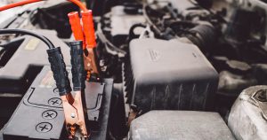Jumper cables on a car battery | Fox Lexus of El Paso in El Paso, TX
