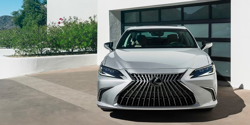 Front view of a 2026 Lexus RX parked at a dealership in El Paso, TX, showcasing its sleek design and distinctive grille.