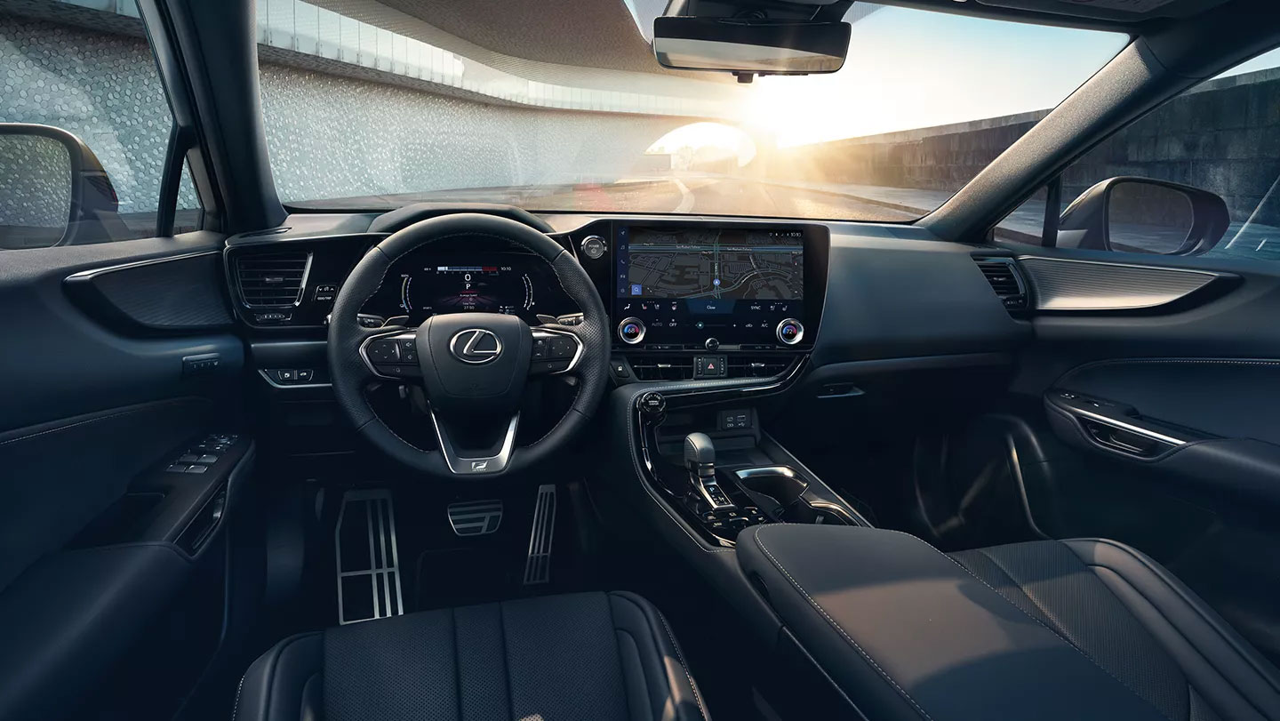A Lexus car interior showcasing a modern dashboard with a touchscreen, leather seats, and ambient lighting.