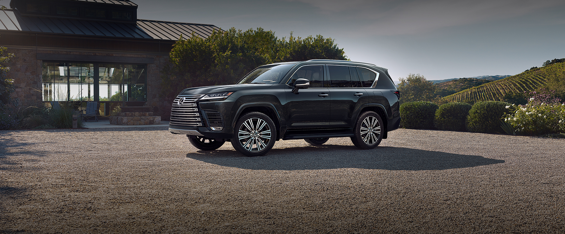 Lexus LX parked in front of a residential house, showcasing its sleek design and robust features.
