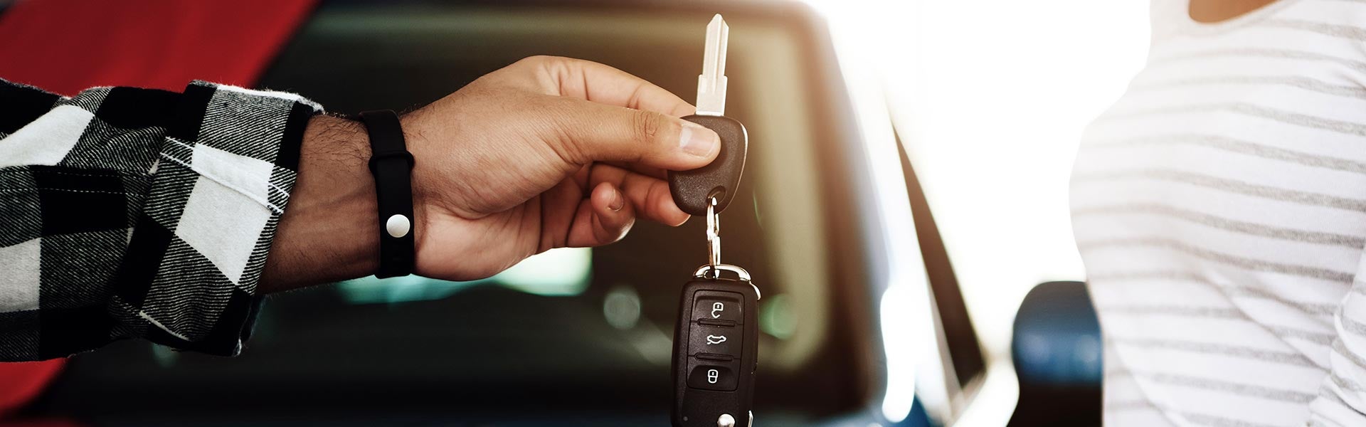 customer getting keys from salesman